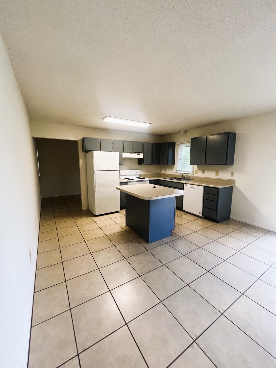 kitchen with tile floor. all appliances included.