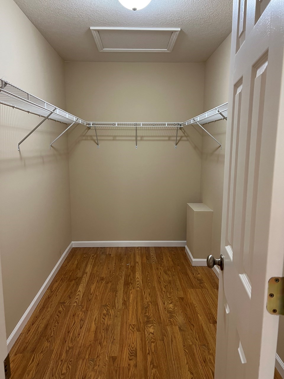 walk in closet in primary bedroom